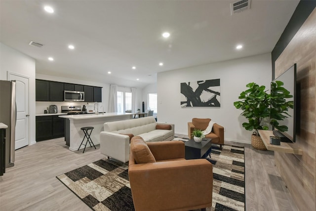 14417 Gray Rocks Rd, Splendora, TX 77372 - living room featuring recessed lighting, visible vents, and light wood-style flooring