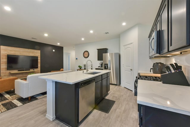 14417 Gray Rocks Rd, Splendora, TX 77372 - kitchen with a sink, recessed lighting, stainless steel appliances, and light wood-type flooring
