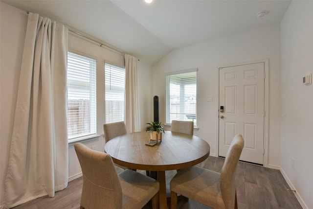 14417 Gray Rocks Rd, Splendora, TX 77372 - dining space featuring wood finished floors, baseboards, and lofted ceiling