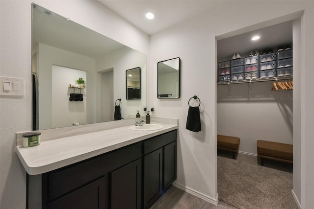 14417 Gray Rocks Rd, Splendora, TX 77372 - bathroom with baseboards and vanity
