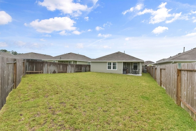 14417 Gray Rocks Rd, Splendora, TX 77372 - back of property with a fenced backyard, a yard, and a patio area
