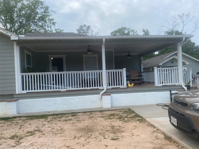 rear view of house with a porch and a ceiling fan