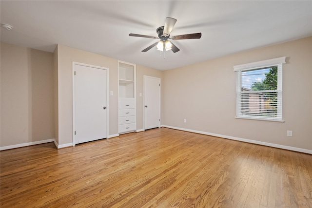 unfurnished bedroom with baseboards, ceiling fan, and light wood-type flooring