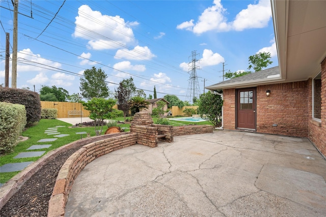 view of patio / terrace featuring a fenced in pool, a fenced backyard, and a hot tub
