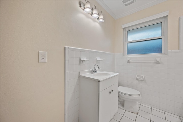 bathroom featuring visible vents, tile walls, tile patterned floors, toilet, and ornamental molding