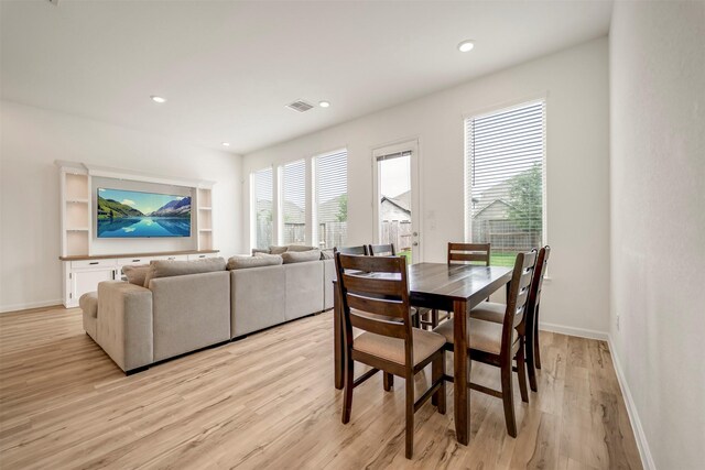 dining space with recessed lighting, baseboards, visible vents, and light wood-style floors