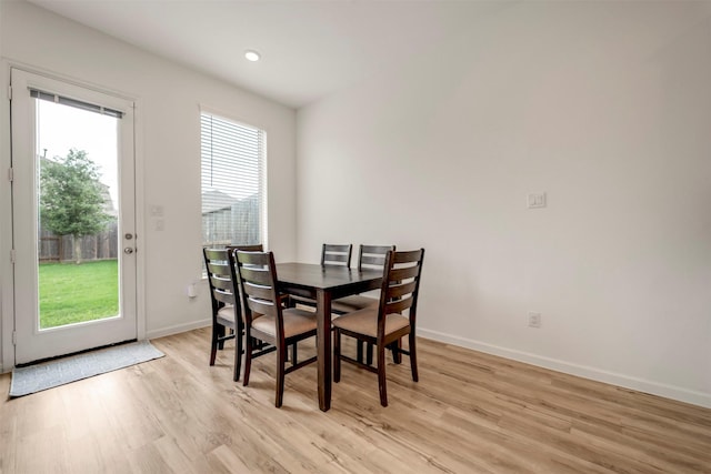 4127 Champlain Way, Iowa Colony, TX 77583 - dining room with light wood-style flooring and baseboards