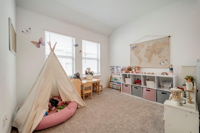 game room featuring carpet floors and vaulted ceiling