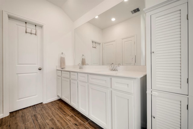 4127 Champlain Way, Iowa Colony, TX 77583 - full bath with a sink, visible vents, recessed lighting, double vanity, and wood tiled floor