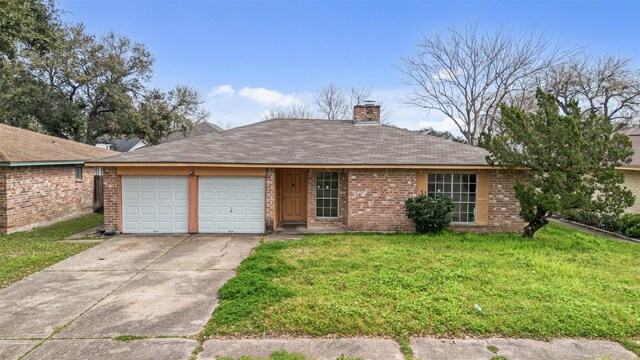 single story home featuring a front yard, a chimney, brick siding, an attached garage, and driveway