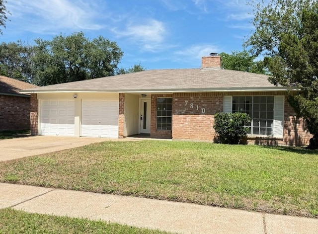7810 Bunker Wood Ln, Houston, TX 77086 - ranch-style home with a chimney, driveway, brick siding, an attached garage, and a front lawn