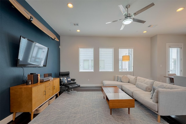 living area featuring recessed lighting, baseboards, visible vents, and ceiling fan