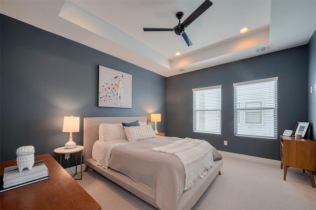 bedroom featuring recessed lighting, visible vents, carpet, and a raised ceiling