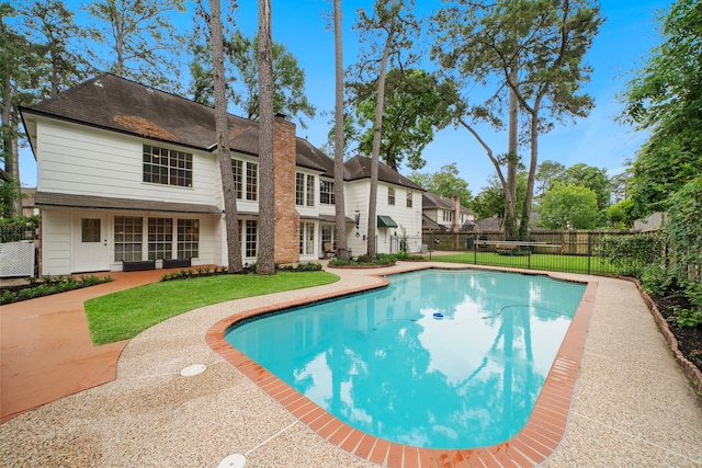 view of pool featuring a fenced in pool, a fenced backyard, and a yard