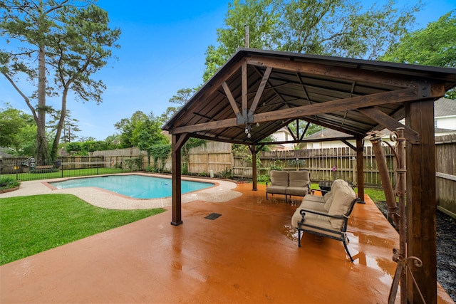 view of pool featuring a lawn, a patio, a fenced backyard, an outdoor living space, and a gazebo