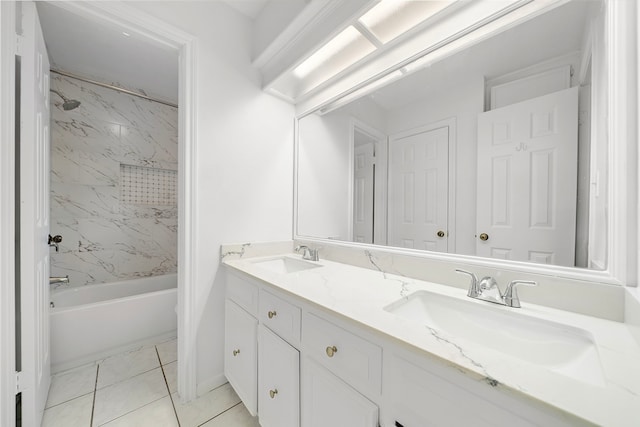 bathroom featuring double vanity, tile patterned floors, shower / tub combination, and a sink