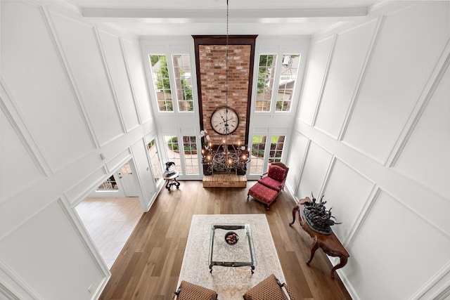 sitting room with a decorative wall and wood finished floors