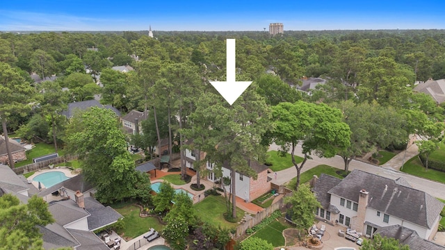 aerial view with a residential view and a wooded view