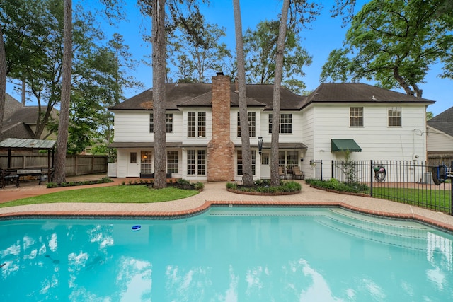 view of swimming pool with a fenced in pool, a yard, fence private yard, and a patio