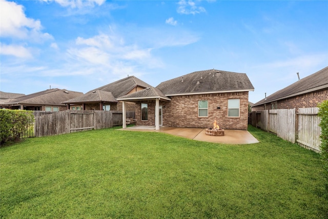 5331 Rue Dela Croix Dr, Katy, TX 77493 - rear view of house with a lawn, brick siding, a fenced backyard, and a patio area