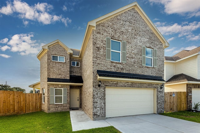 traditional home with fence, a front yard, brick siding, an attached garage, and driveway