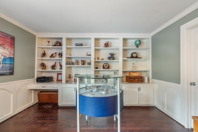 office area featuring a wainscoted wall, ornamental molding, a decorative wall, and dark wood-style floors