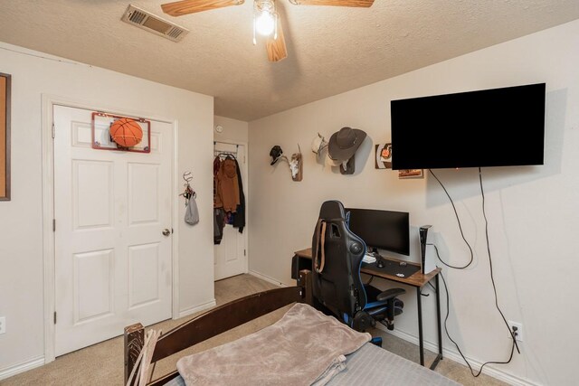bedroom with visible vents, a ceiling fan, baseboards, and carpet floors