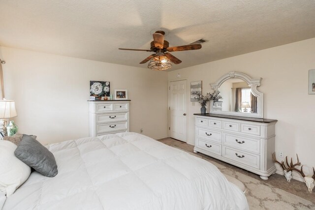 bedroom featuring baseboards, a ceiling fan, and light colored carpet