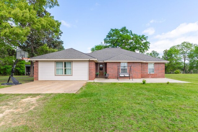 ranch-style house with a front lawn and brick siding