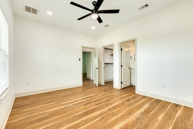 unfurnished bedroom with recessed lighting, baseboards, visible vents, and light wood-type flooring