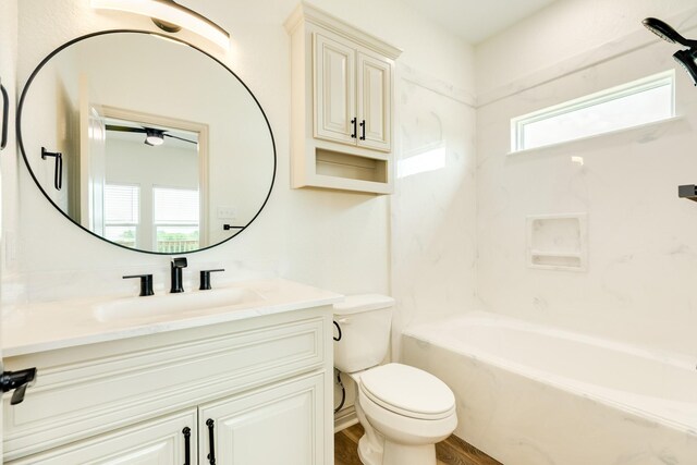 full bath with toilet, wood finished floors, and vanity