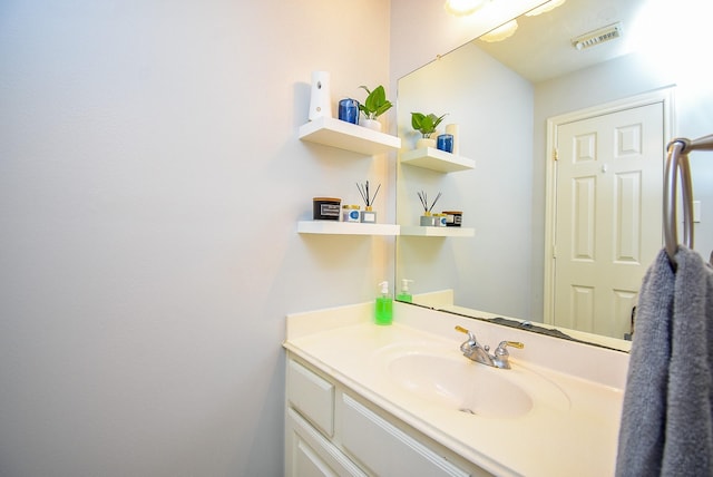 bathroom featuring vanity and visible vents