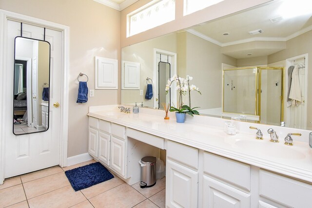 full bath featuring tile patterned flooring, a sink, and ornamental molding