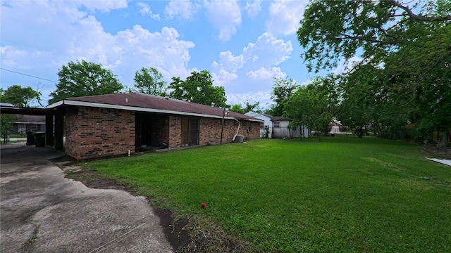 exterior space featuring concrete driveway, fence, and an attached carport