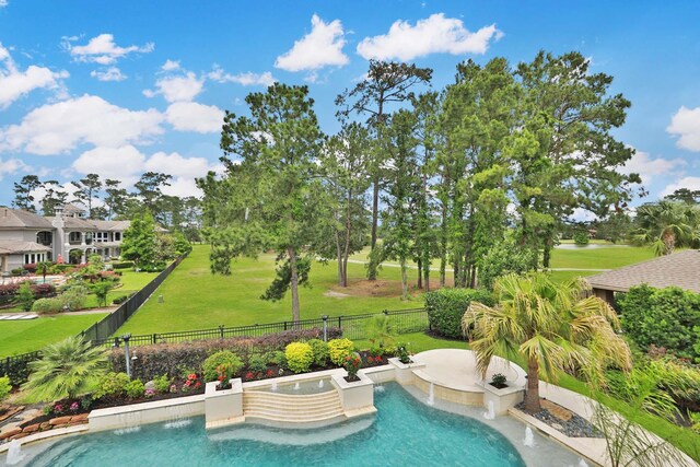 view of pool with a fenced in pool, fence, and a yard