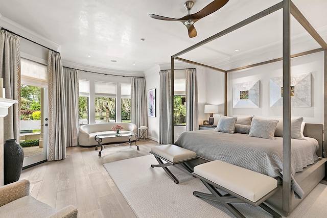 bedroom with crown molding, access to outside, and light wood-style flooring