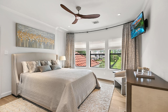 bedroom featuring crown molding, recessed lighting, visible vents, and light wood-style floors