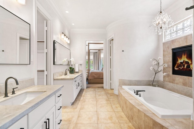 ensuite bathroom featuring ensuite bathroom, a sink, and a wealth of natural light