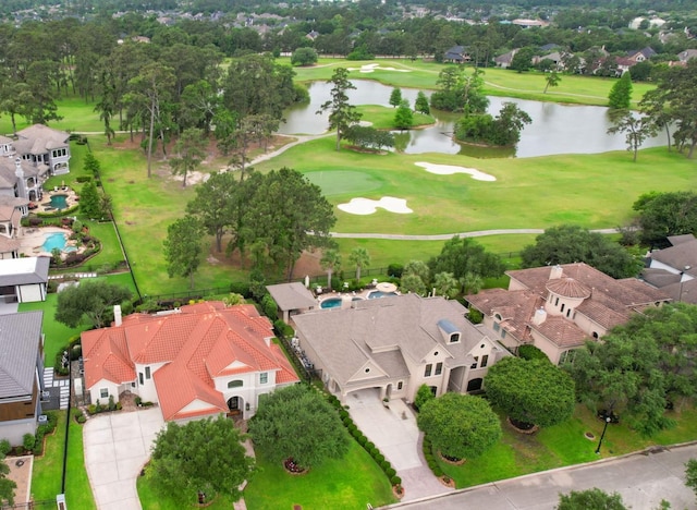 aerial view with a water view, view of golf course, and a residential view