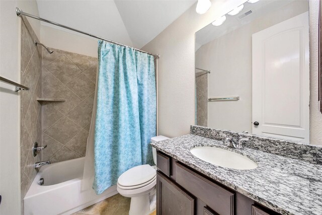 bathroom featuring vanity, toilet, tile patterned floors, shower / bath combo with shower curtain, and visible vents
