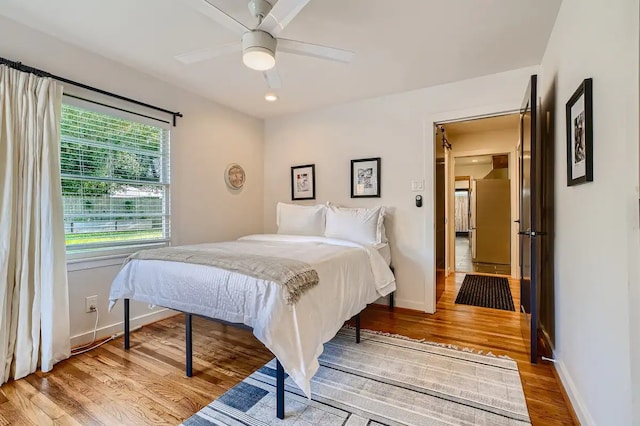 bedroom with recessed lighting, baseboards, ceiling fan, and wood finished floors