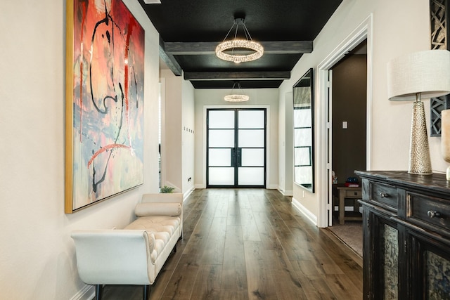 hallway with dark wood-style flooring, baseboards, a chandelier, and beam ceiling