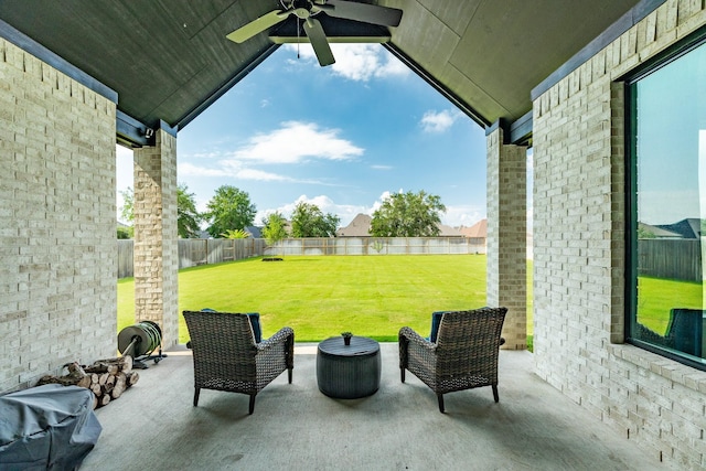 view of patio with a fenced backyard and a ceiling fan