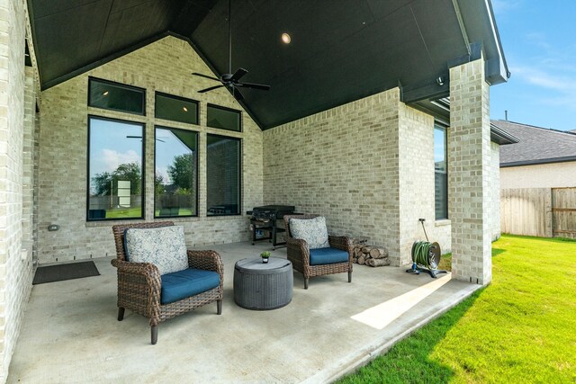 view of patio / terrace with a ceiling fan and fence