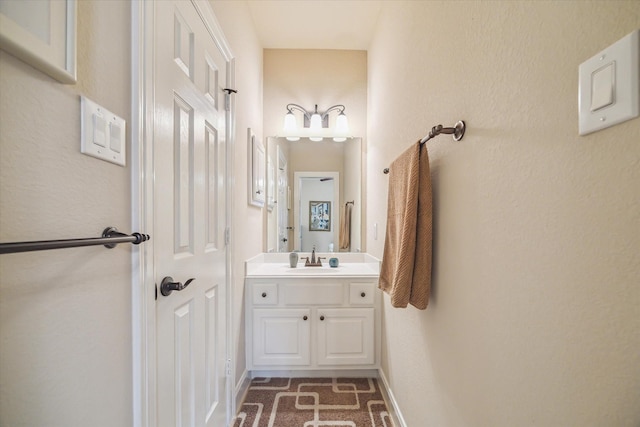bathroom featuring vanity and baseboards