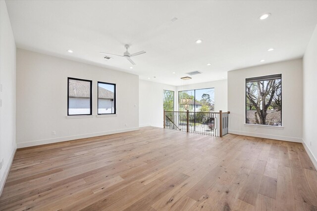 unfurnished room featuring recessed lighting, light wood finished floors, ceiling fan, and baseboards