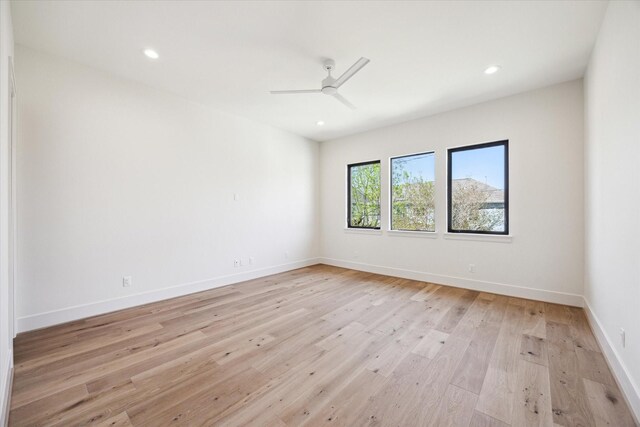 empty room featuring recessed lighting, ceiling fan, baseboards, and light wood-style floors