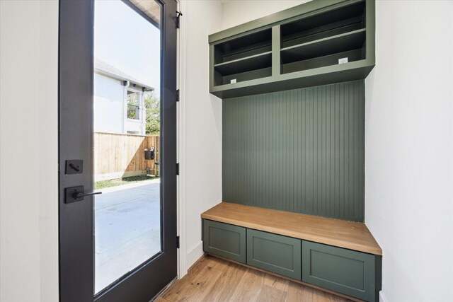mudroom with light wood-style floors
