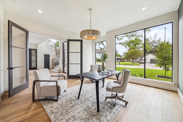 home office featuring recessed lighting, a notable chandelier, and light wood-type flooring