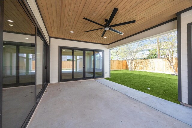 view of patio / terrace with fence and ceiling fan